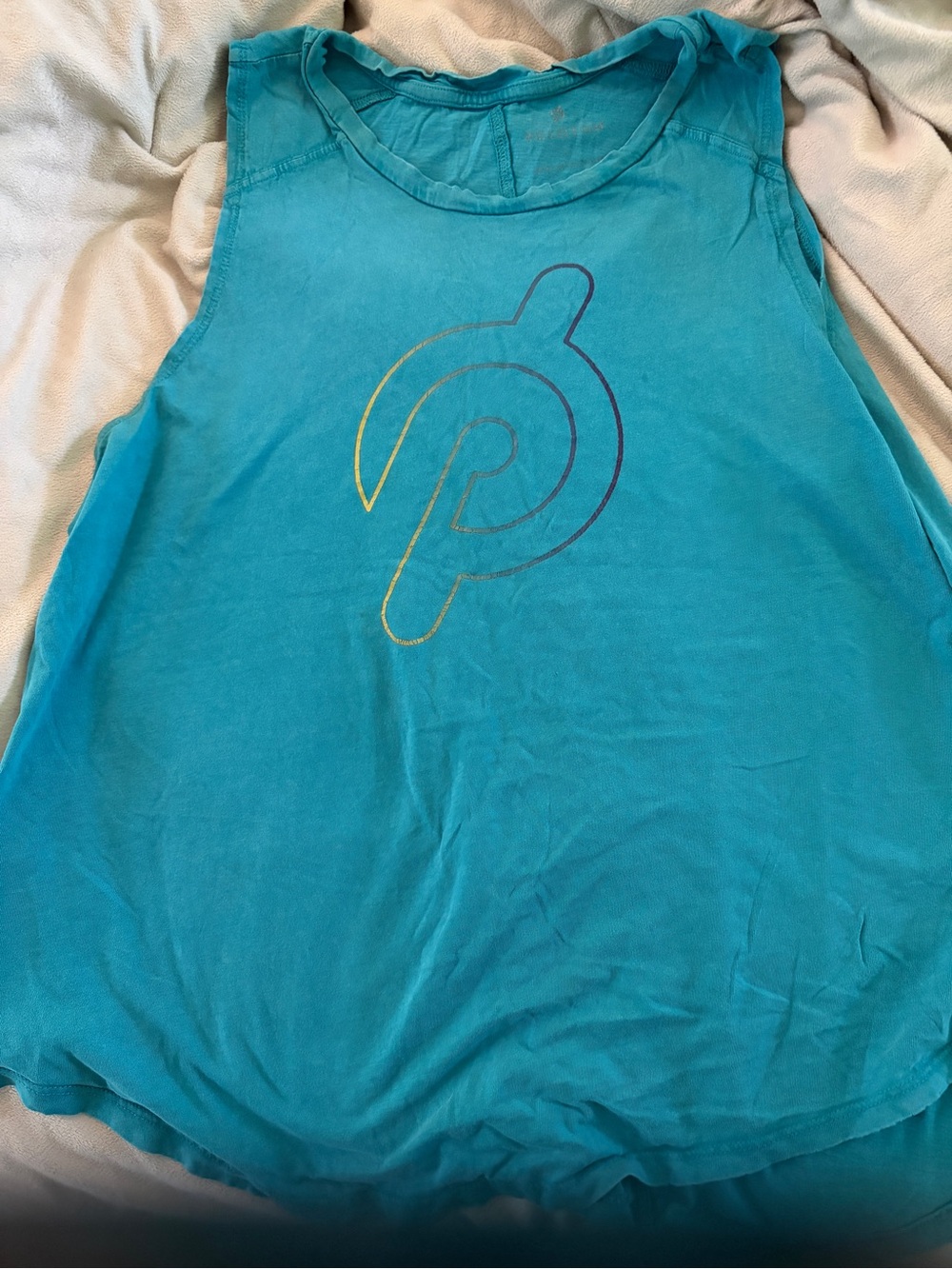 Five items.  Four Peloton Logo Sleeveless Workout Tanks and one workout pant
